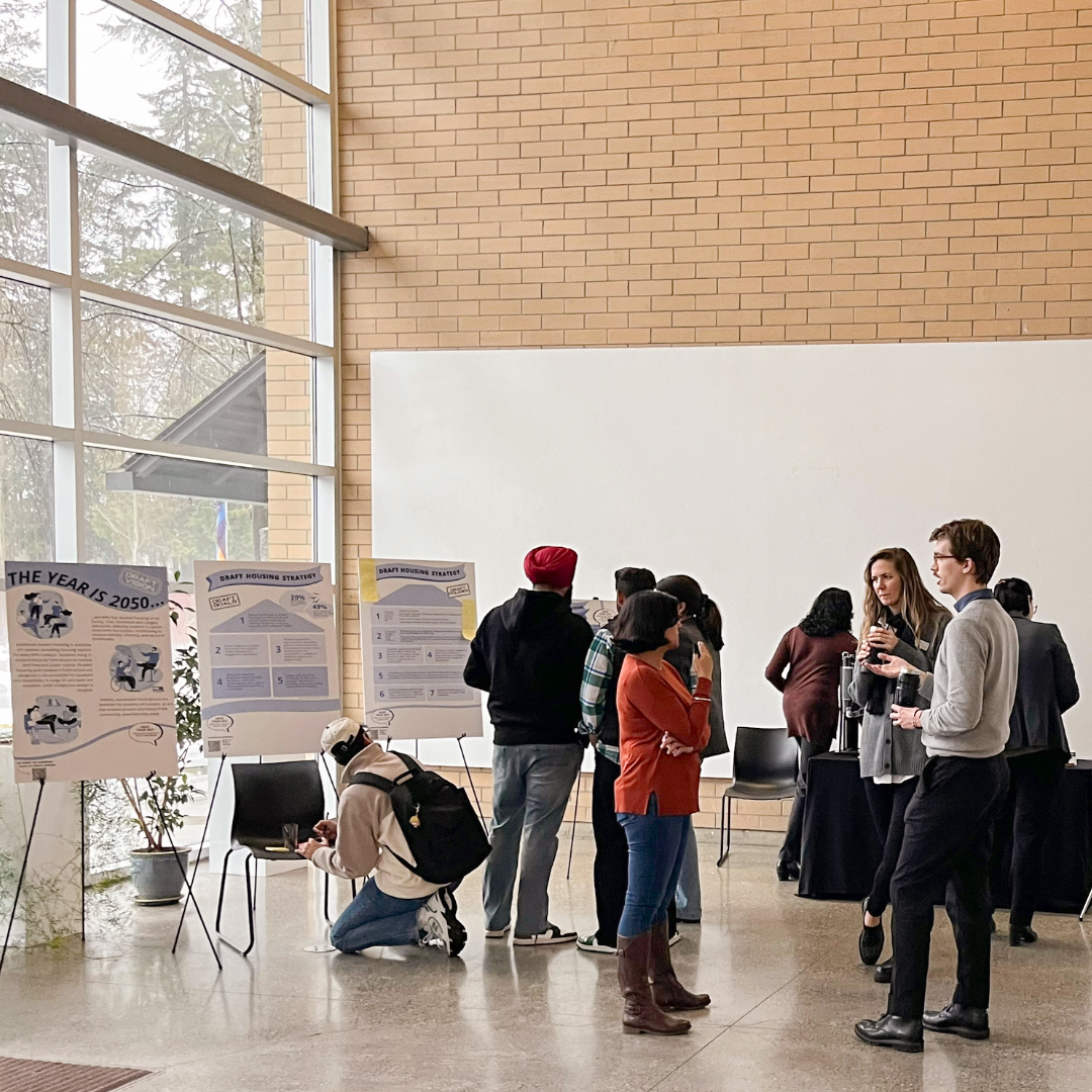 people gathered near boards on easels 